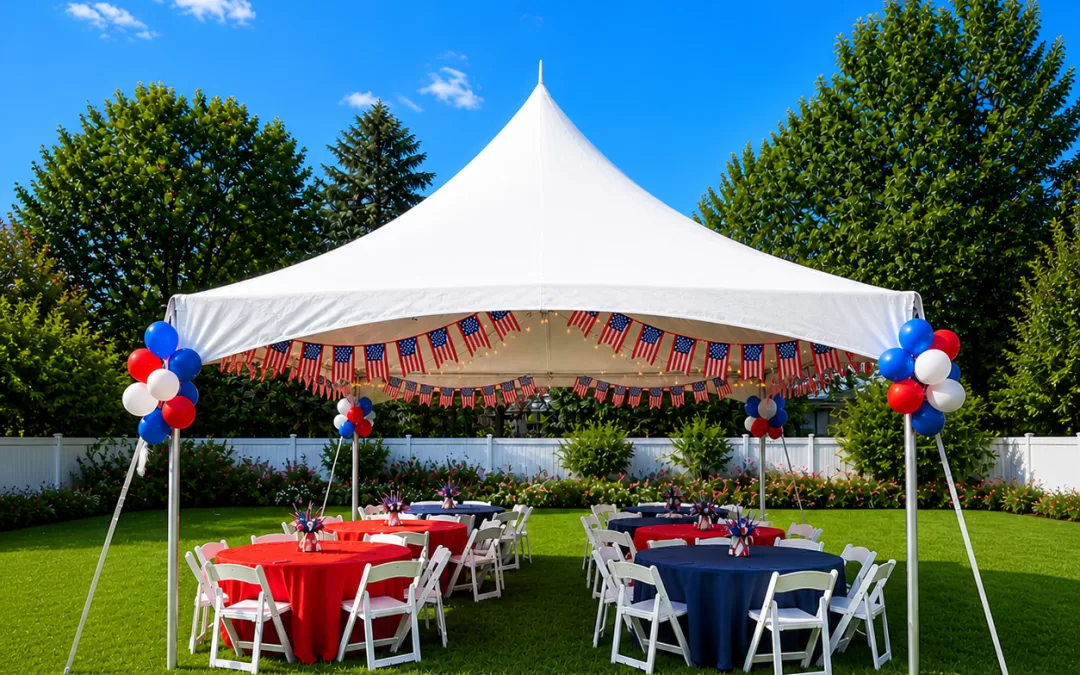 White high peak frame tent set up for a graduation party in a suburban backyard in West Seneca NY with red and navy tablecloths, white folding chairs, red white and blue balloon clusters, and bright blue sky